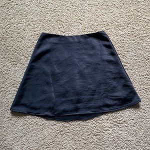 White Fox women’s black satin mini skirt (size XS)